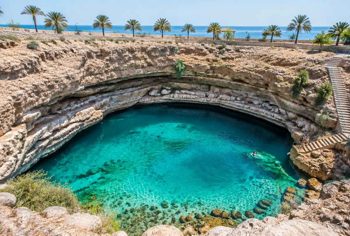 The turquoise limestone pool of Bimmah Sinkhole near the Omani coast