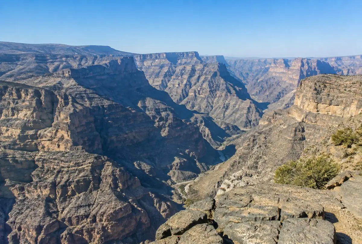 The deep canyon and layered cliffs of Jabal Shams in Oman