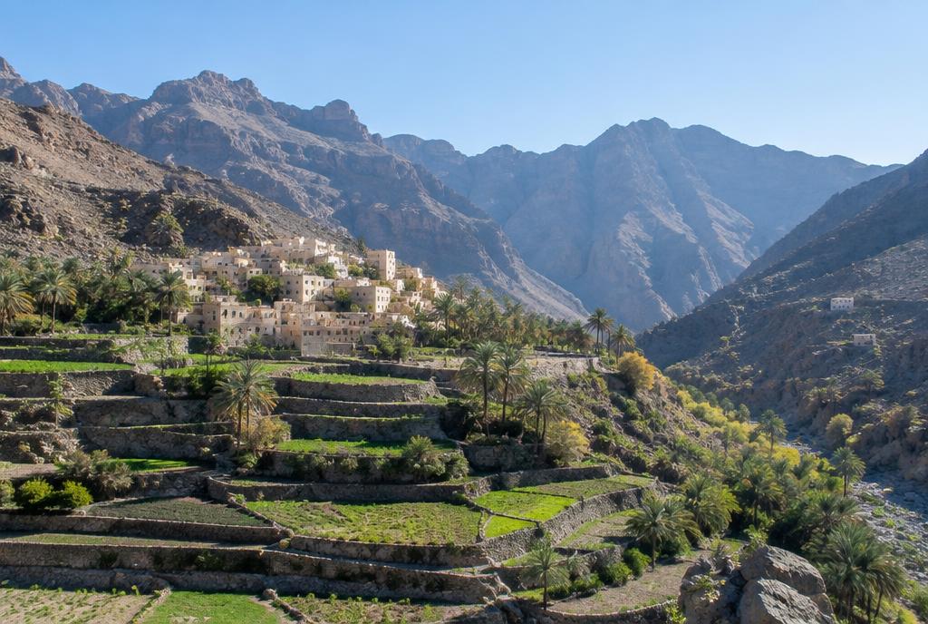 Terraced mountain village in Oman under clear winter light